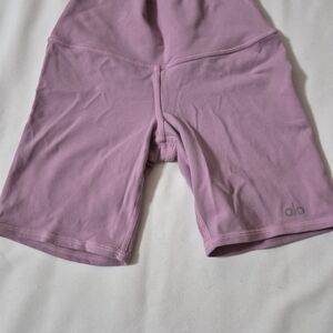 Alo Yoga High-Waist Biker Shorts, likely in a pink or lavender color XXS